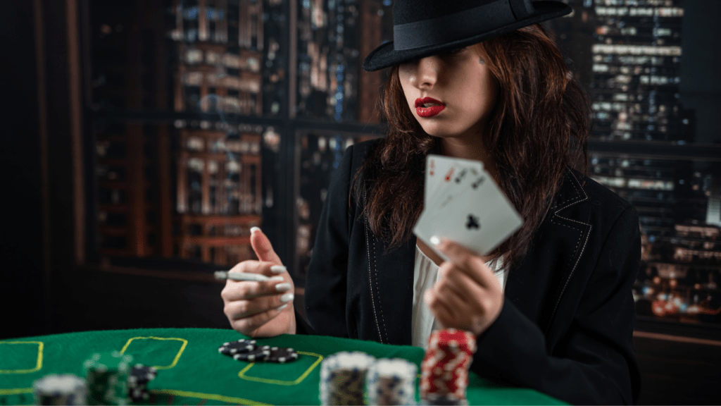 A woman holding four Aces and playing poker