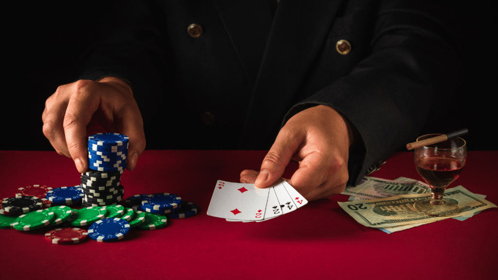 Man holding Playing cards and chips