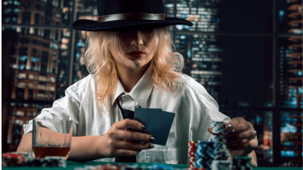 A woman holding Playing cards and Chips